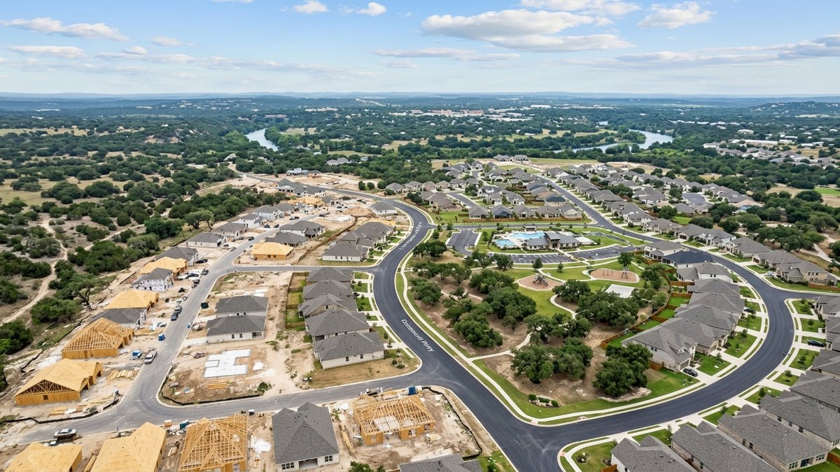 Natural aerial of new-construction neighborhoods near New Braunfels. Used for Mayfair and new-construction market posts.